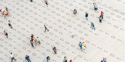 Long-term insights briefing image, groups of people walking over binary code