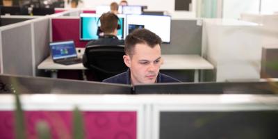 Staff working at desks in office